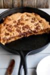 The best buttery and gooey Nutella stuffed deep dish chocolate chip skillet cookie will have you weak at the knees wanting more! There's nothing better than a warm chocolate chip cookie straight out of the oven, especially one that is oozing with chocolate hazelnut Nutella. Every bite melts in your mouth! | cafedelites.com
