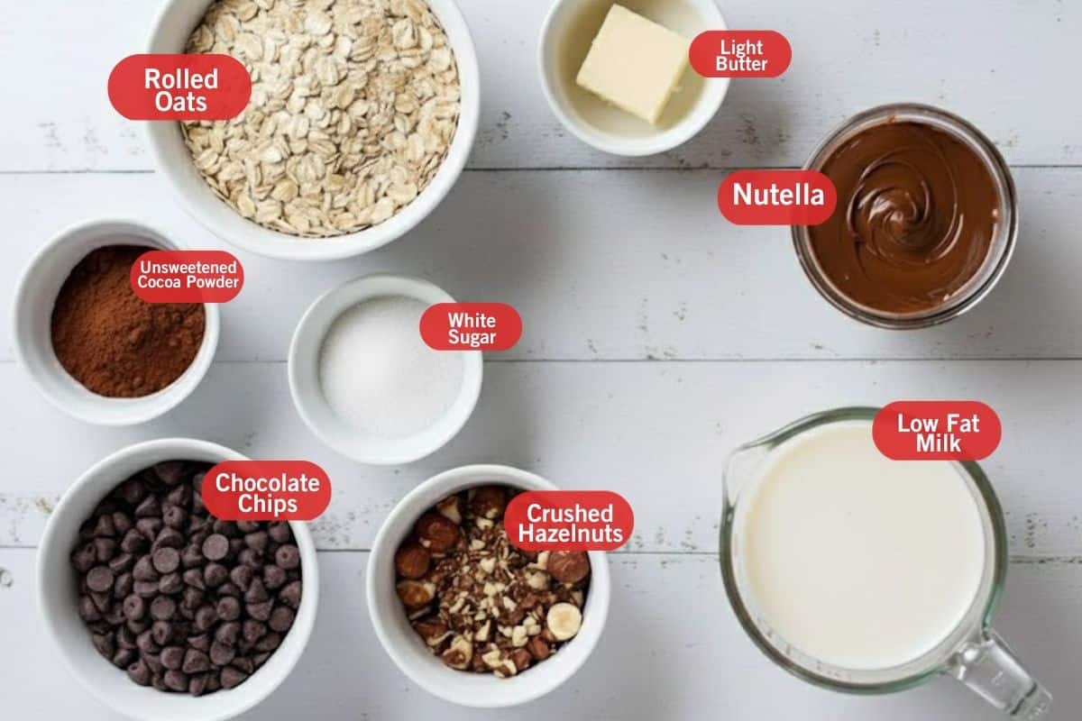 Flat lay photo of ingredient shot of rolled oats, light butter, nutella, low fat milk, crushed hazelnuts, chocolate chips, unsweetened cocoa powder, white sugar