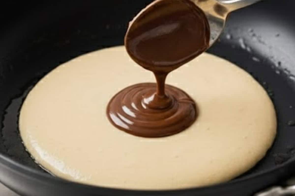 Spoon a small amount of Nutella into the center.