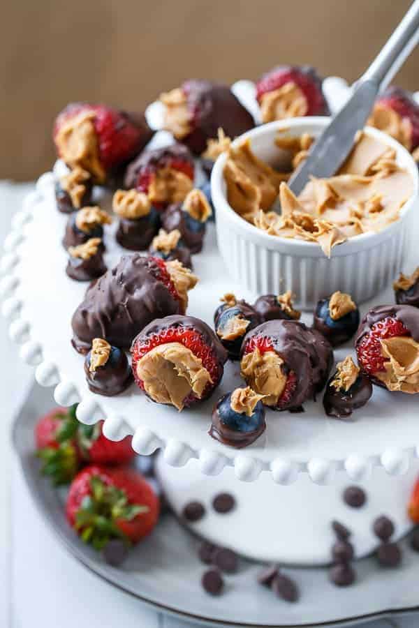 Peanut Butter Stuffed Chocolate Covered Berries and peanut butter in a bowl 