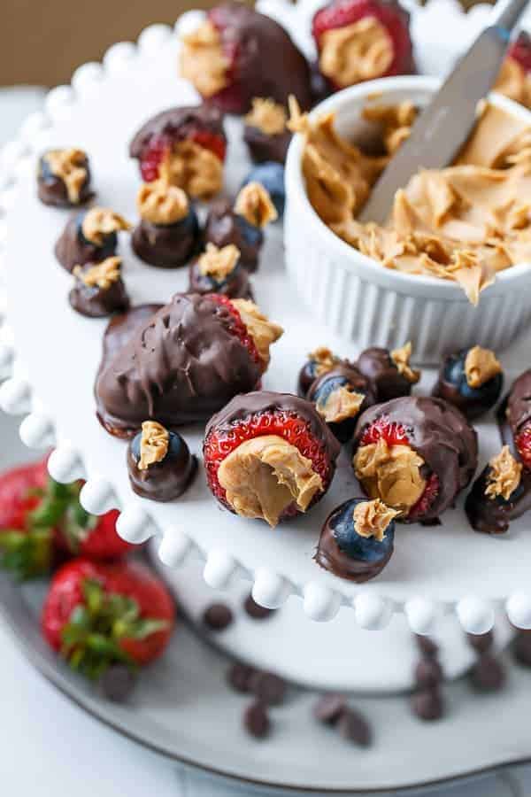 Peanut Butter Stuffed Chocolate Covered Berries | https://cafedelites.com