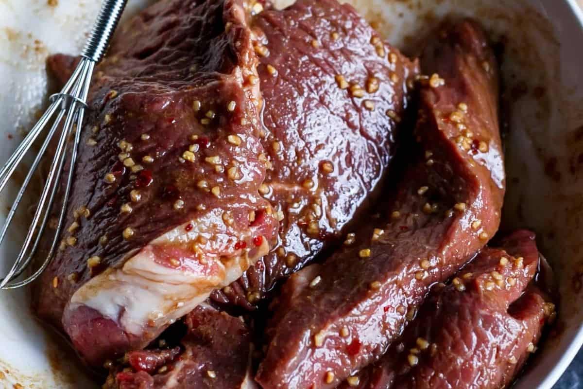 Pour half of the marinade over the beef fillets and turn to coat - 4