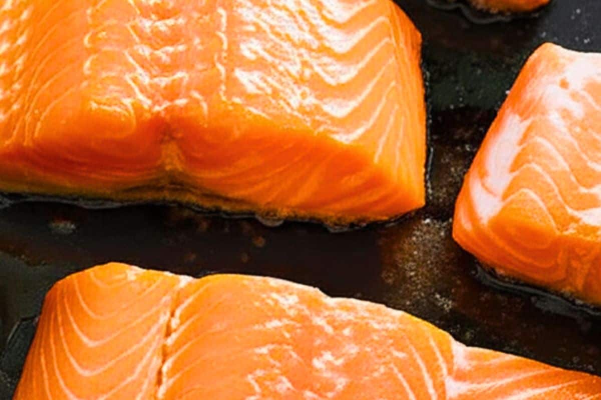 Cook the salmon fillets until golden.