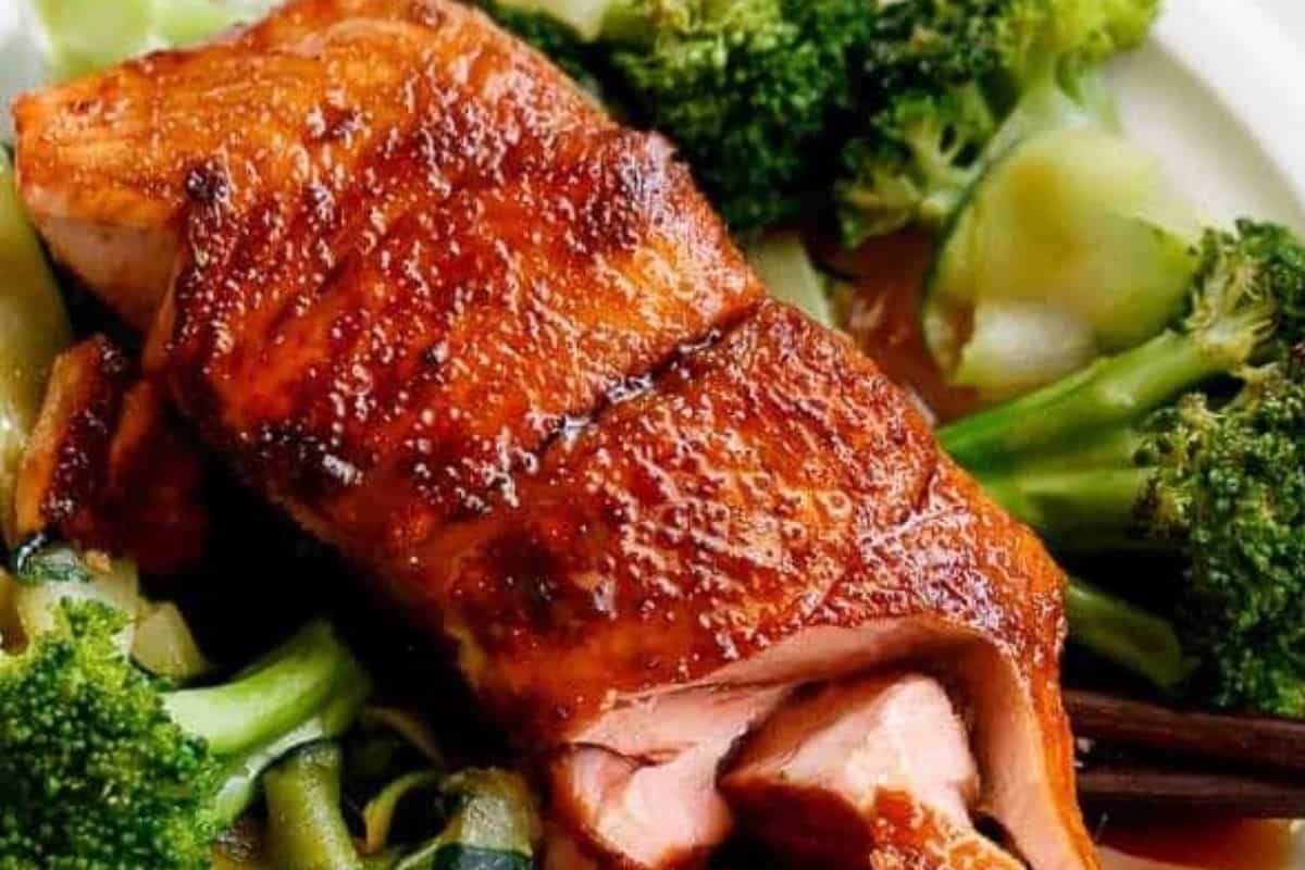 Serve the salmon over steamed vegetables and garnish with green onions