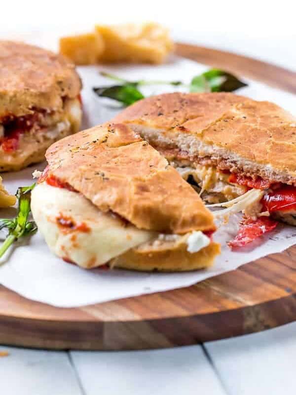Focaccia Three-Cheese Italian Grilled Cheese sandwich pieces on a wooden plater