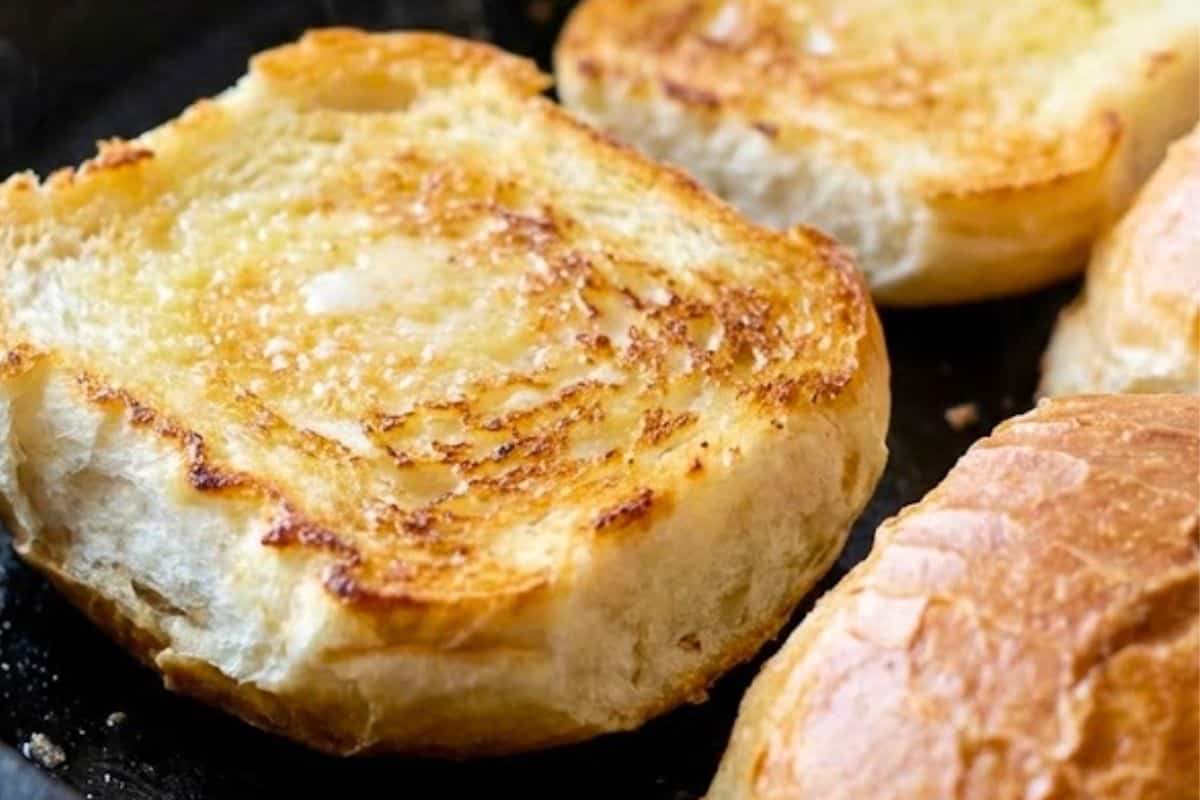 Slice and toast the sourdough rolls under the pan until lightly crisp - 8