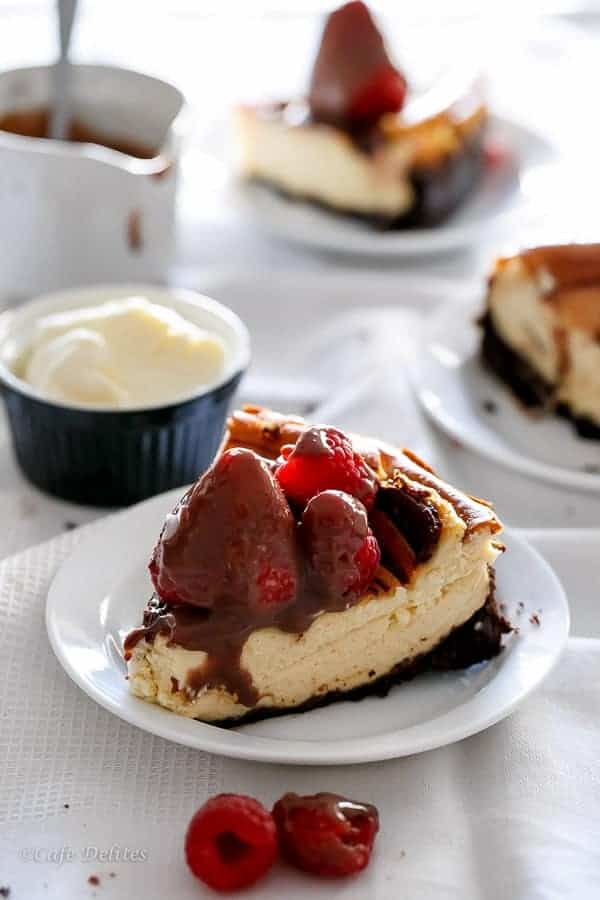 Nutella Swirl Cheesecake with Nutella Fudge Sauce | https://cafedelites.com