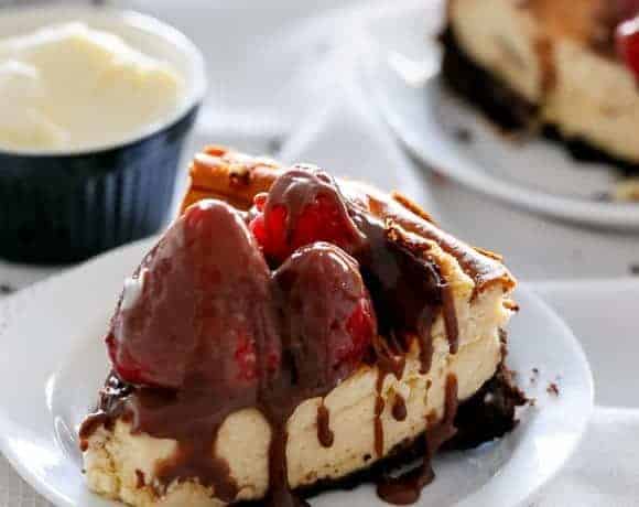 Nutella Swirl Cheesecake with Nutella Fudge Sauce | https://cafedelites.com
