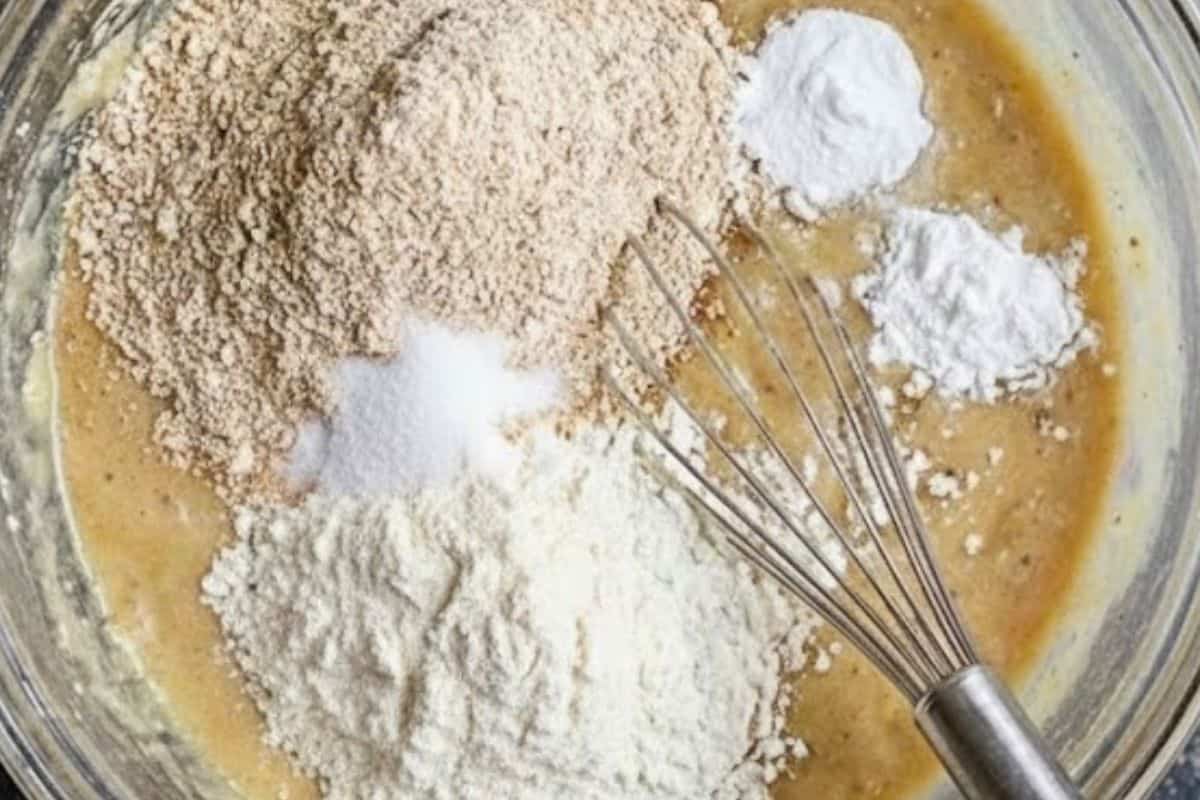 Add the flours, salt, baking soda, and baking powder to the bowl. - 5