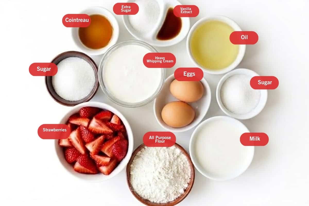 Flat lay photo of ingredient shot of sugar, strawberries, all purpose flour, milk, sugar, oil, eggs, heavy whipping Crean, cointreau, extra sugar, vanilla extract