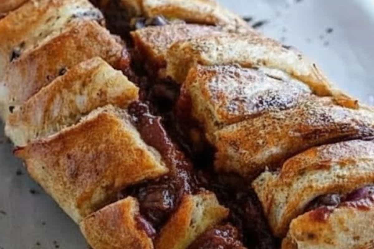 Spoon or squeeze barbecue sauce into every cut, making sure it coats the inside of the loaf so each pull apart - 5