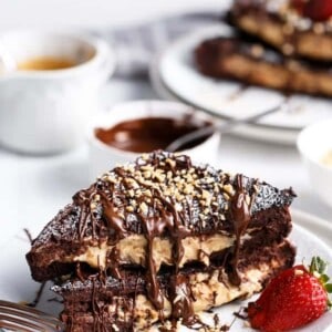 Chocolate brownie peanut butter cheesecake stuffed french toasts on a plate