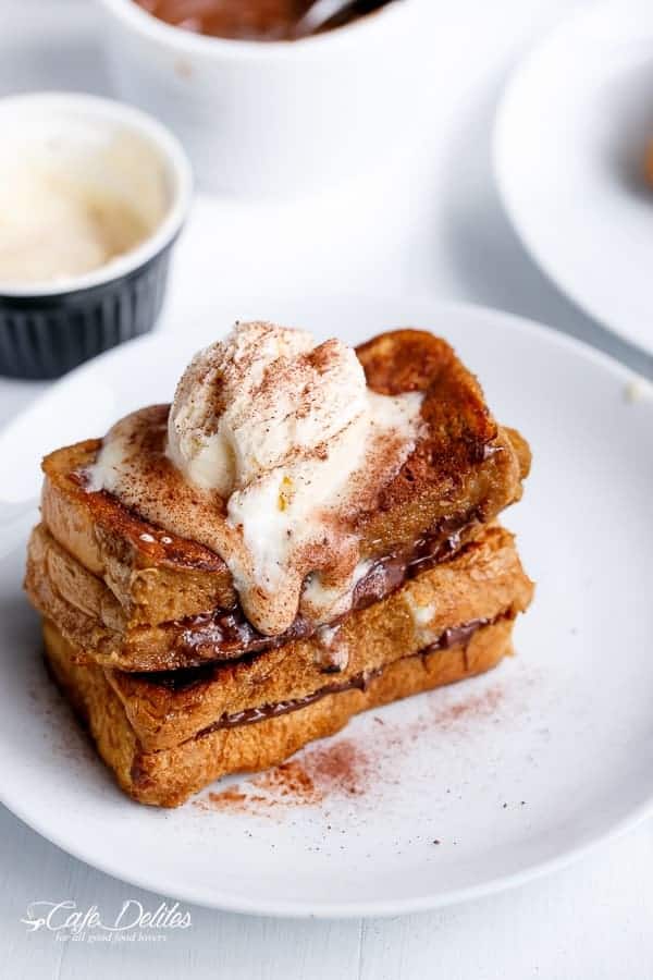 Chocolate Stuffed Cappuccino French Toast with Coffee Cream and Chocolate Powder and a scoop of ice cream