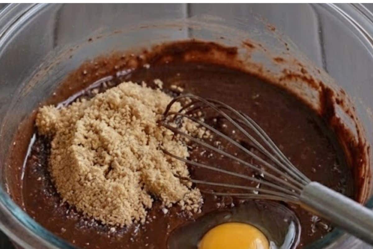 Whisk brown sugar into the chocolate mixture until combined. Add eggs one at a time - 5