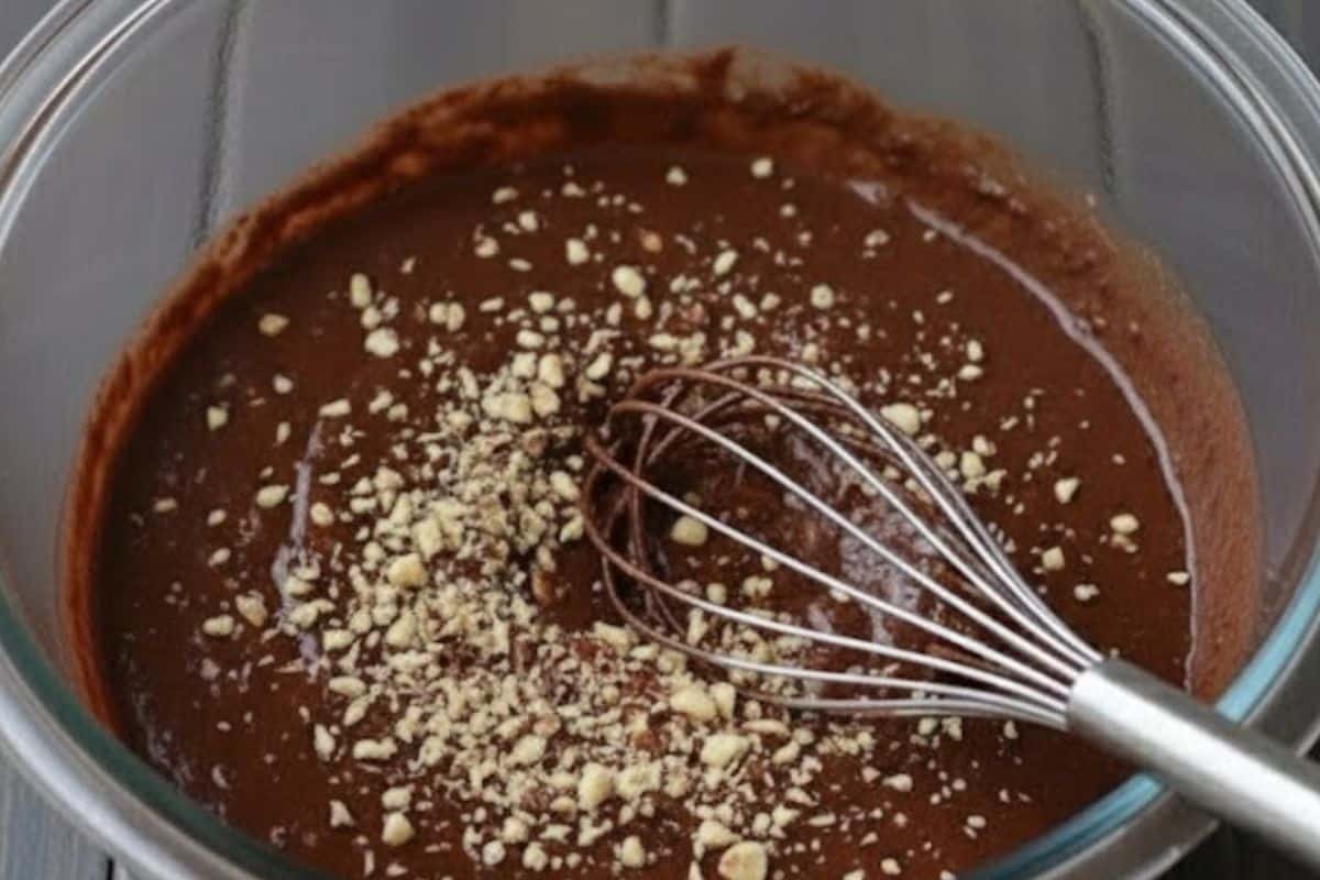 Fold crushed hazelnuts through the dough - 7