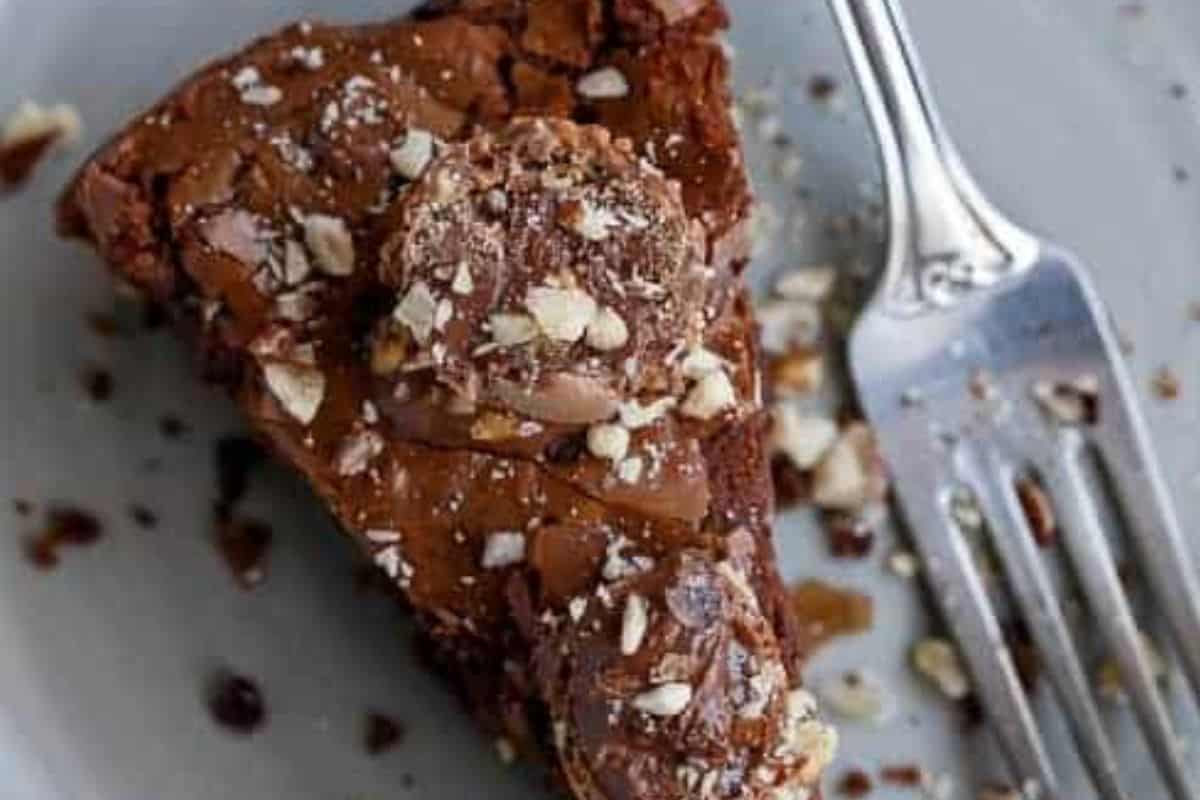 Bake for 25 to 30 minutes for a softer centre, or up to 10 minutes longer for a more set cookie. Cool for 10 minutes, then top with extra crushed hazelnuts and halved Ferrero Rochers. - 10