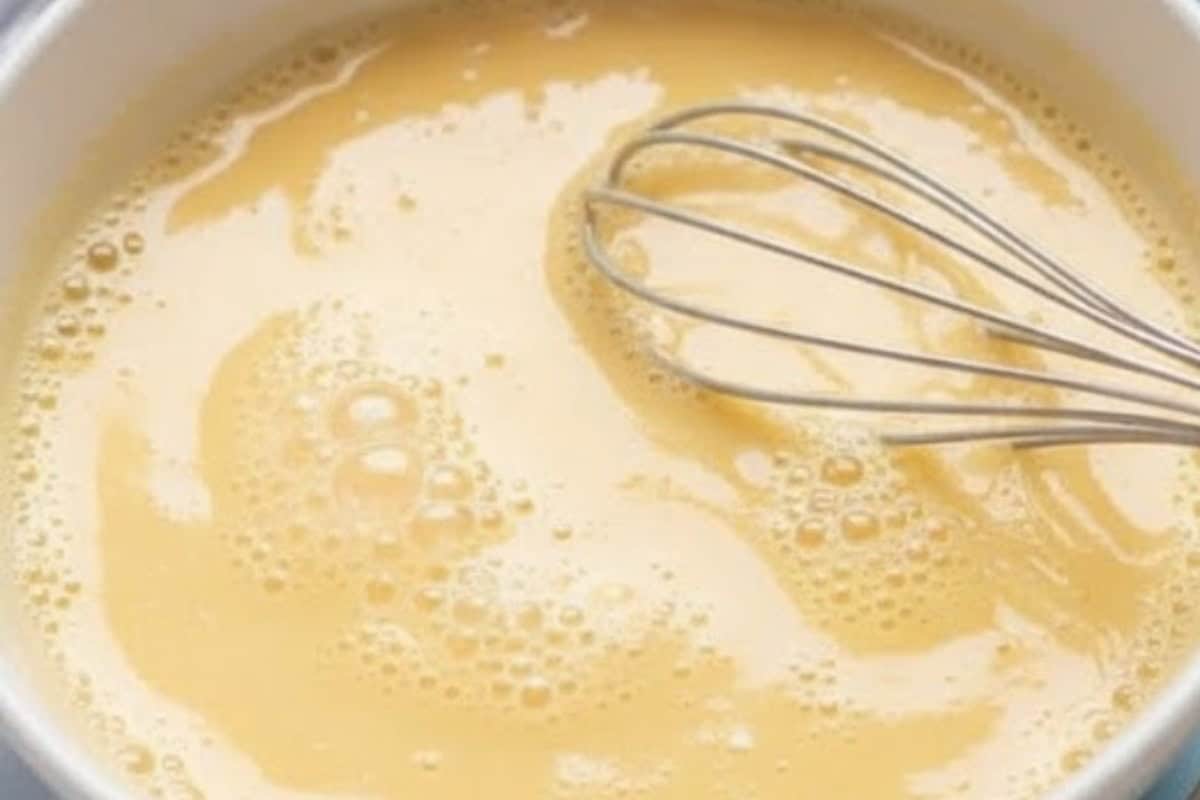 In a shallow bowl, whisk together the eggs, milk, lemon juice, sugar, and vanilla extract. - 3