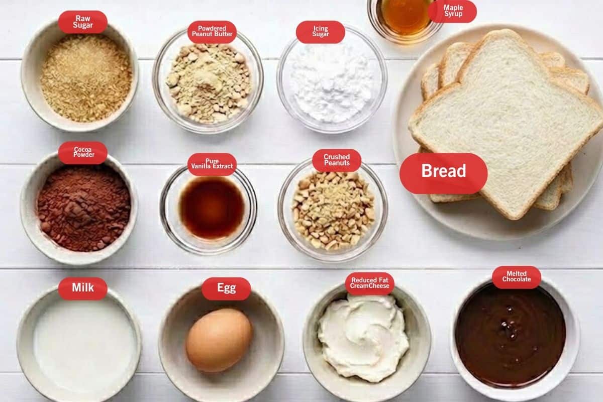 Flat lay photo of ingredient shot of Stuffed Peanut Butter French Toast
( raw sugar, powdered peanut butter, icing sugar, maple syrup, bread, melted chocolate, crushed peanuts, pure vanilla extract, egg, reduced fat cream cheese, milk, cocoa powder) - 2
