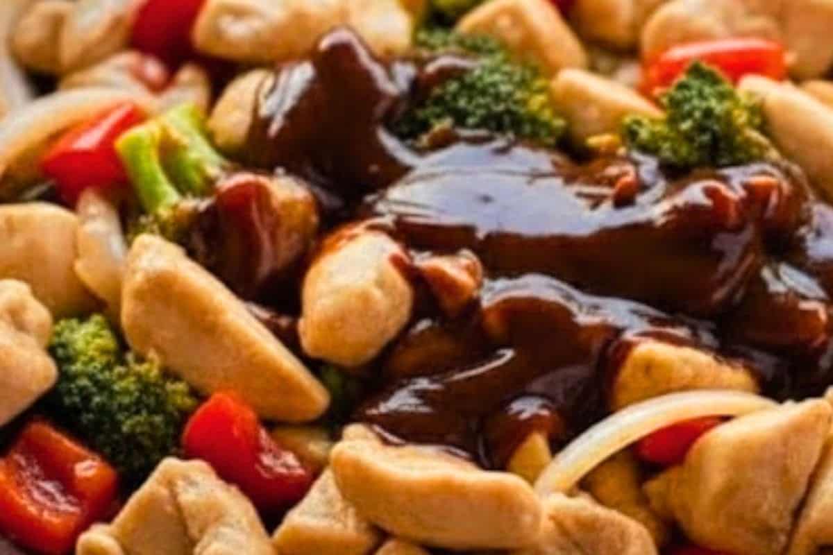 Return chicken to the pan with the remaining hoisin, rice wine vinegar, soy sauce, and ground ginger. Stir-fry for 2 minutes to coat evenly.