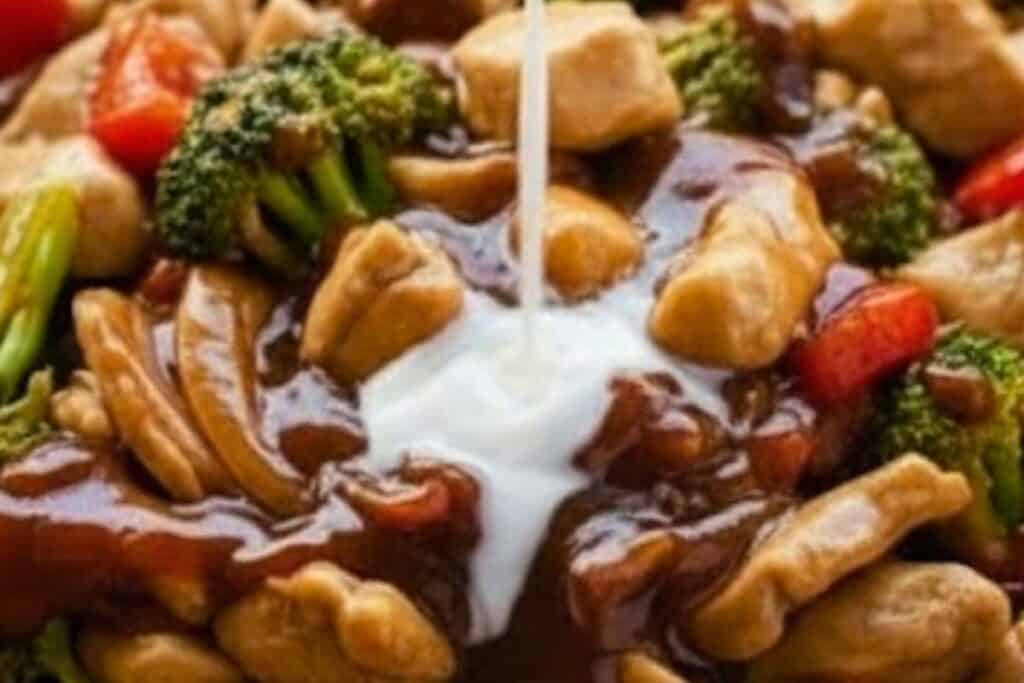 Mix the cornflour and water together, then pour it into the pan and stir-fry for another 3 minutes until the sauce thickens and everything looks glossy.