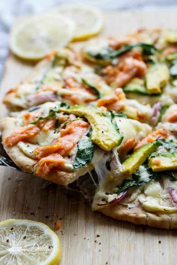 Smoked Salmon and Avocado Pizza with a herb cream cheese base and peppery arugula leaves Smoked Salmon and Avocado Pizza