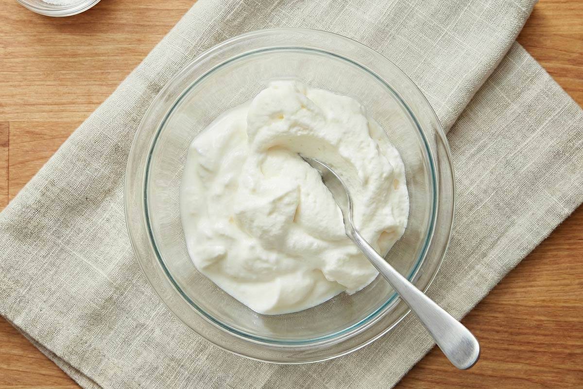 Mixing the Greek yogurt and whipped cream in a small bowl. - 9