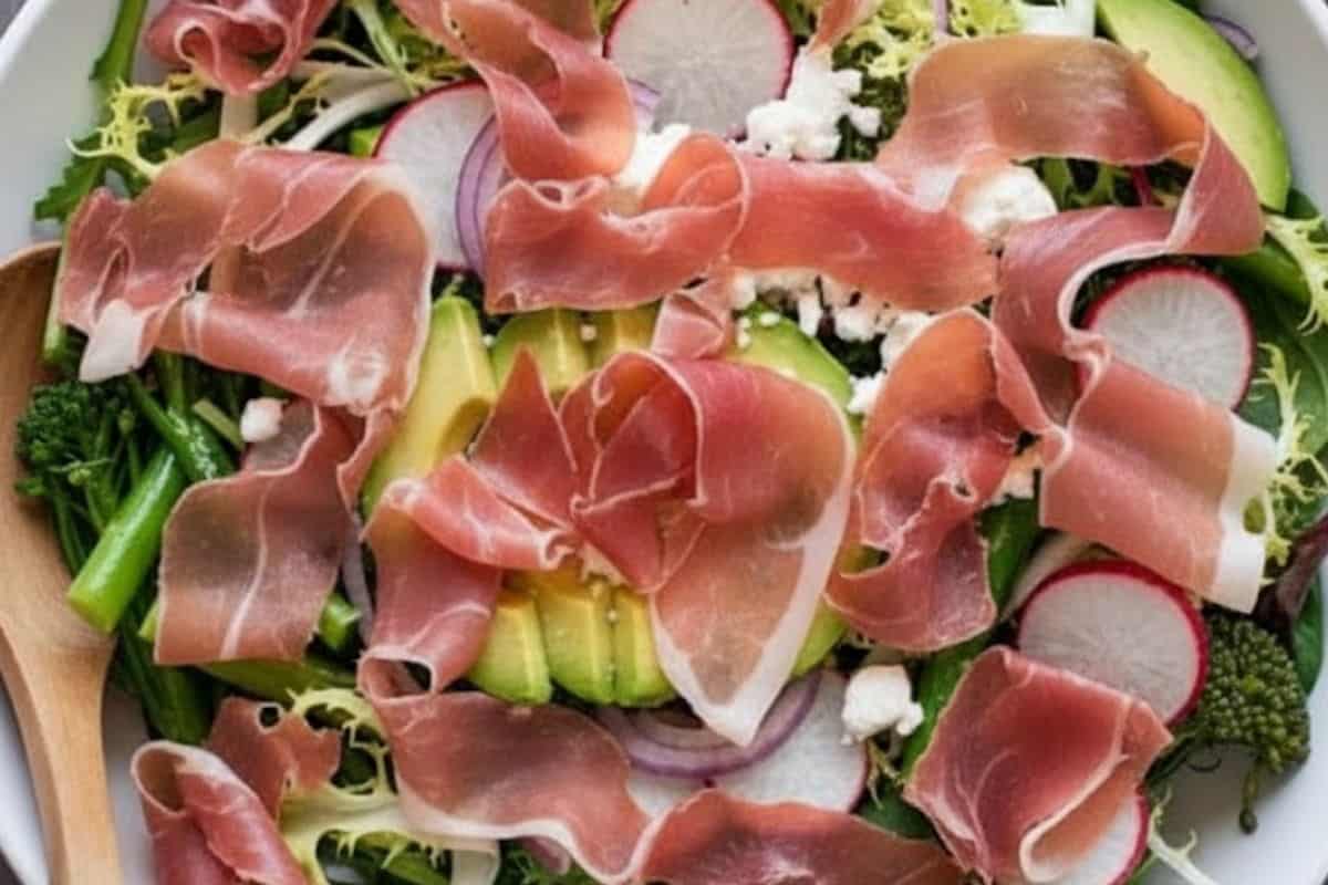 Tear the prosciutto into strips and scatter them evenly across the salad. - 6