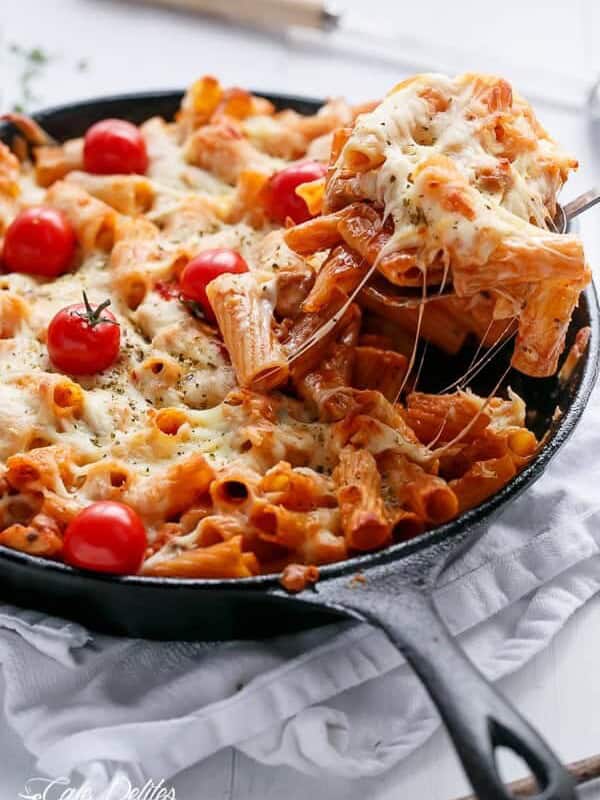 Cheesy Chicken and Roasted Tomato Mozzarella Pasta Bake in a pan
