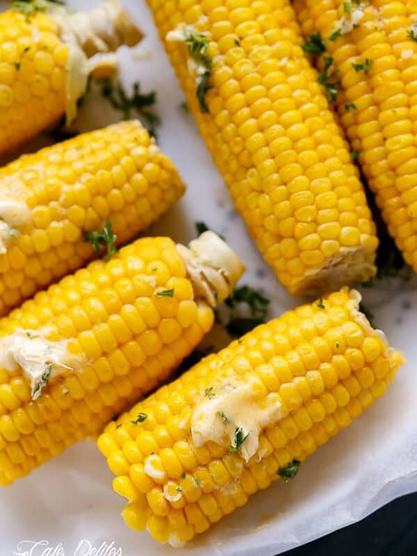 Corn On The Cob With Garlic Butter pieces on a tray