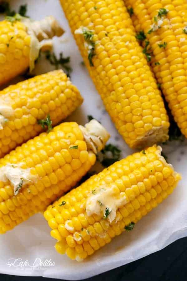 Corn On The Cob With Garlic Butter pieces on a tray