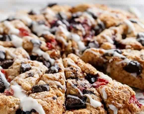 Mixed Berry and Chocolate Chunk Buttermilk Scones with a Cream Cheese Glaze | https://cafedelites.com