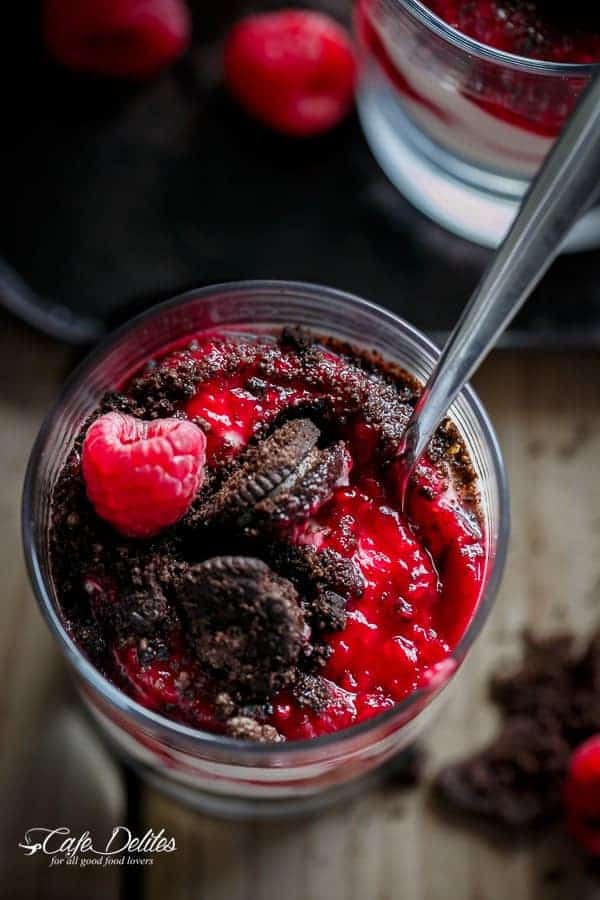 Raspberry Oreo No Bake Cheesecake Parfaits with silver spoon in a jar