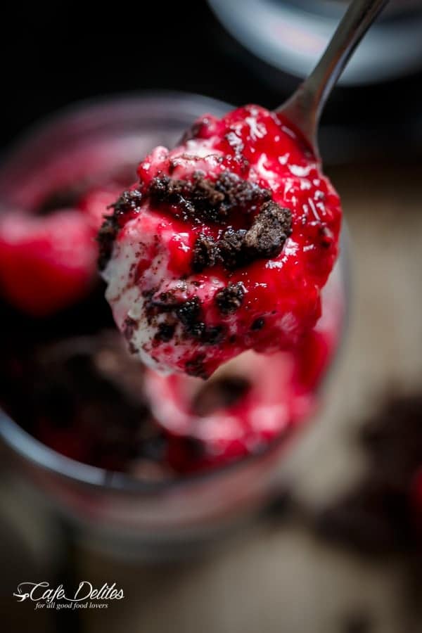 Raspberry Oreo No Bake Cheesecake Parfaits on a spoon