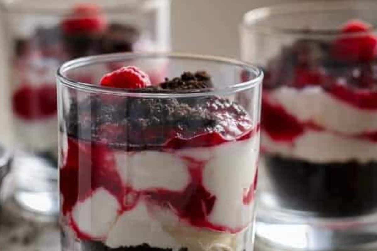 Repeat layers with remaining Oreo crumbs, cheesecake filling, and raspberry sauce, then top with fresh raspberries  - 6