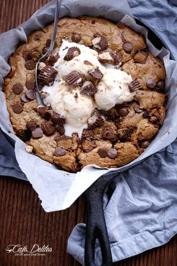 Reese's Nutella Stuffed Peanut Butter Chocolate Chip Deep Dish Skillet Cookie | https://cafedelites.com