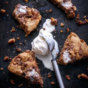 Nutella Stuffed Reese's Peanut Butter Chocolate Chip Skillet Cookie with some ice cream scoop