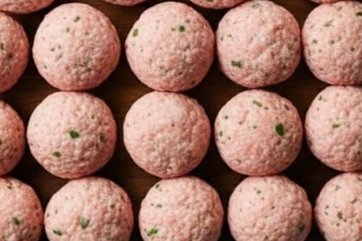 Roll the mixture into evenly sized balls, about two inches in diameter, making around 18 meatballs  - 4