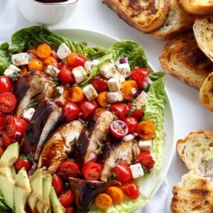 Grilled Balsamic Chicken and Avocado Bruschetta Salad on a plater