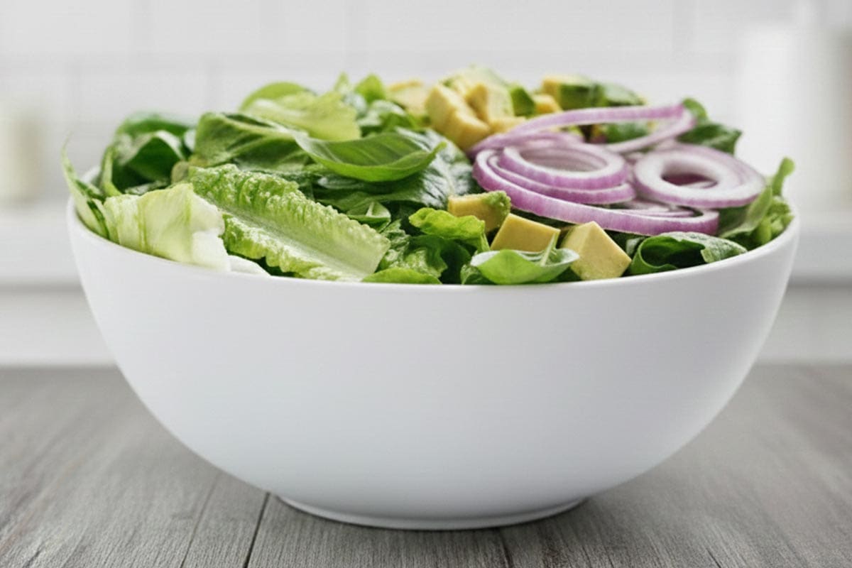 Placed the lettuce, avocado, red onion, and basil leaves in a large bowl. - 6