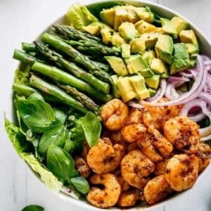 Blackened Shrimp, Asparagus and Avocado Salad with Lemon Pepper Yogurt Dressing in a bowl