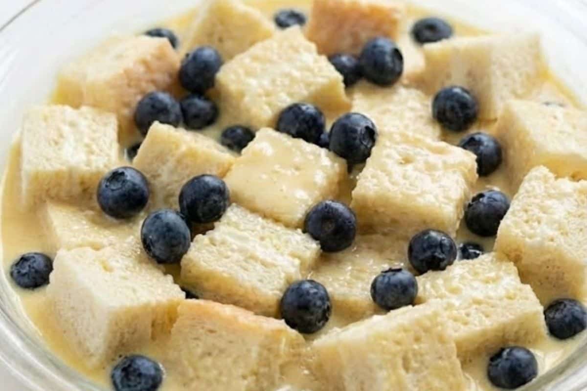 Add the bread cubes to the custard and gently mix until everything is evenly coated. - 7