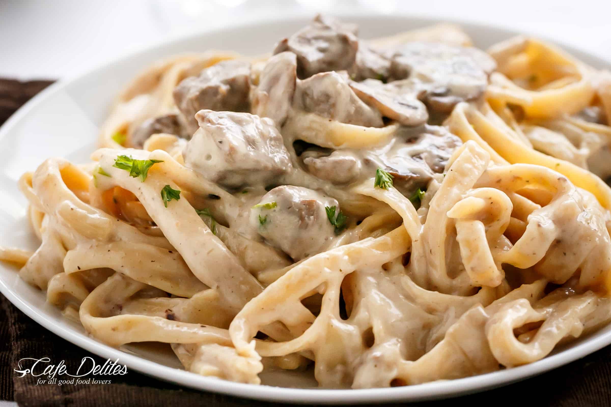 Creamy Beef and Mushroom Stroganoff is the ultimate creamy white wine sauce with steak and mushrooms! | cafedelites.com