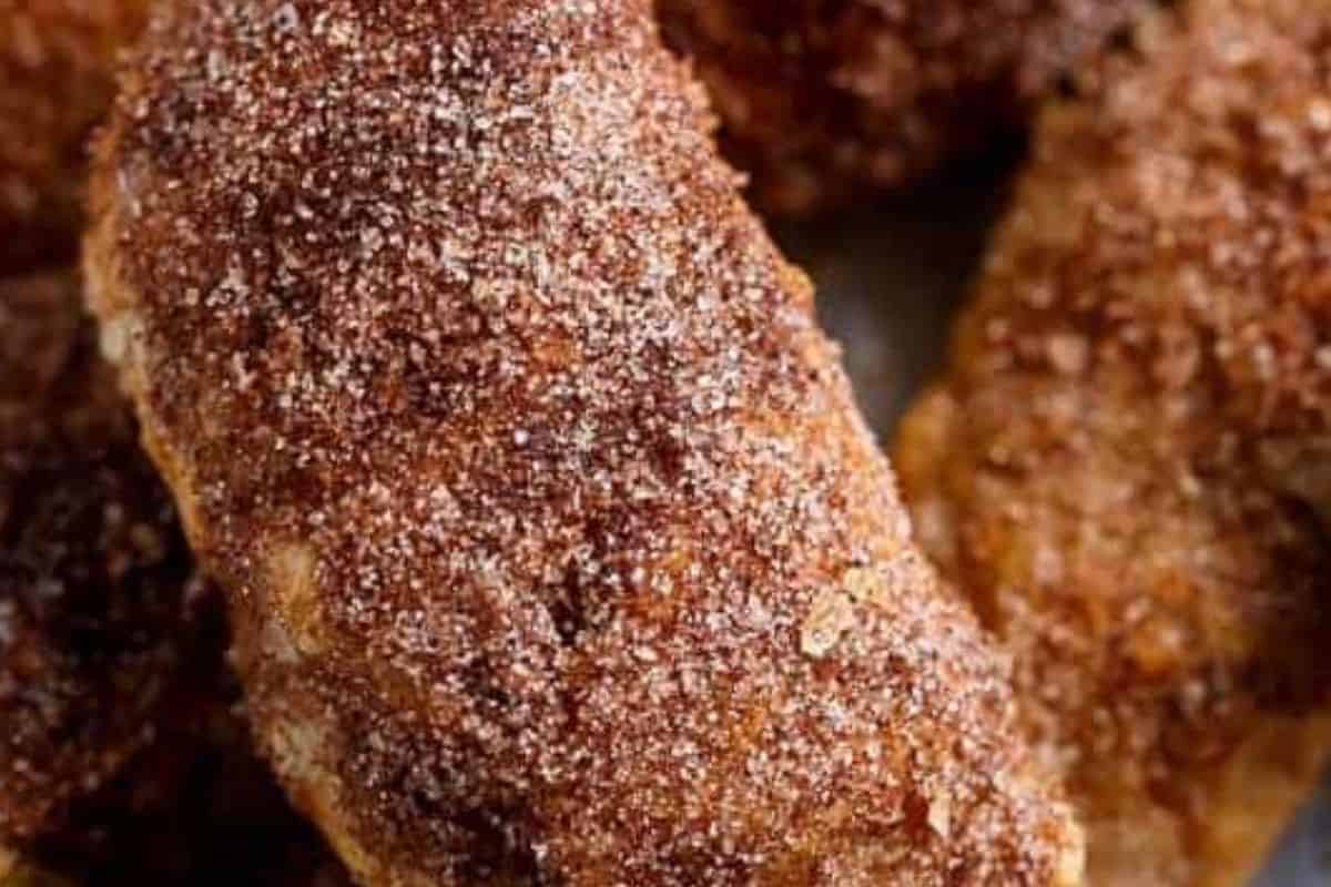 Let the empanadas cool for five minutes, then brush them with melted butter and roll in the cinnamon sugar - 9