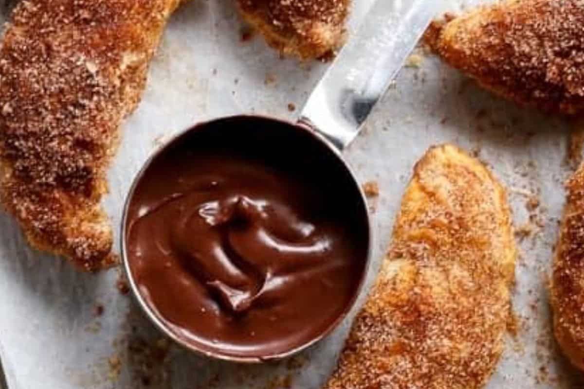 Melt the chocolate with milk over low heat or in the microwave in short bursts. Stir in chili powder, vanilla, cinnamon, and Nutella. - 10