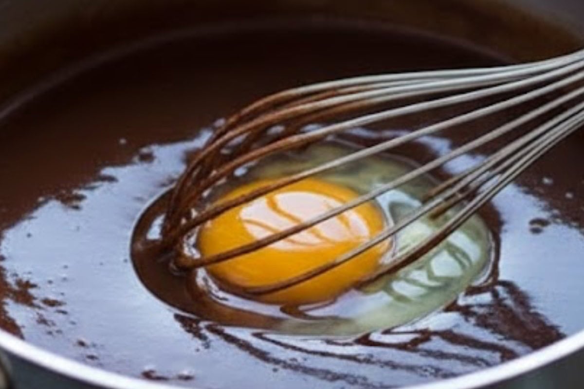 Add the vanilla, then whisk in the eggs one at a time - 6