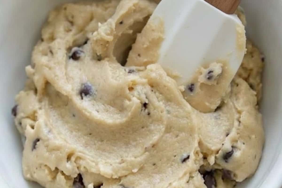 Beat together the butter, vanilla, and sugars until creamy, then mix in the flour and salt and fold through half the chocolate chips. - 8