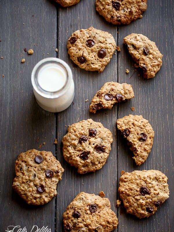 Flourless Oatmeal Peanut Butter Chocolate Chip Cookies on a wooden table with milk in bottle