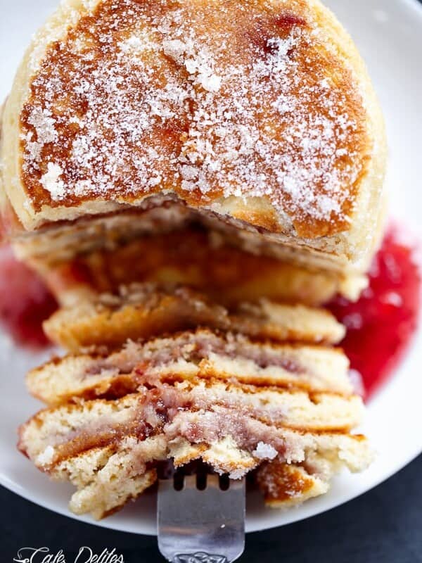 A fork pierced on Jam (Jelly) Donut Pancakes pieces