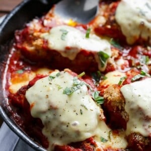 One Pan Mozzarella Stuffed Chicken Parmesan on a pan
