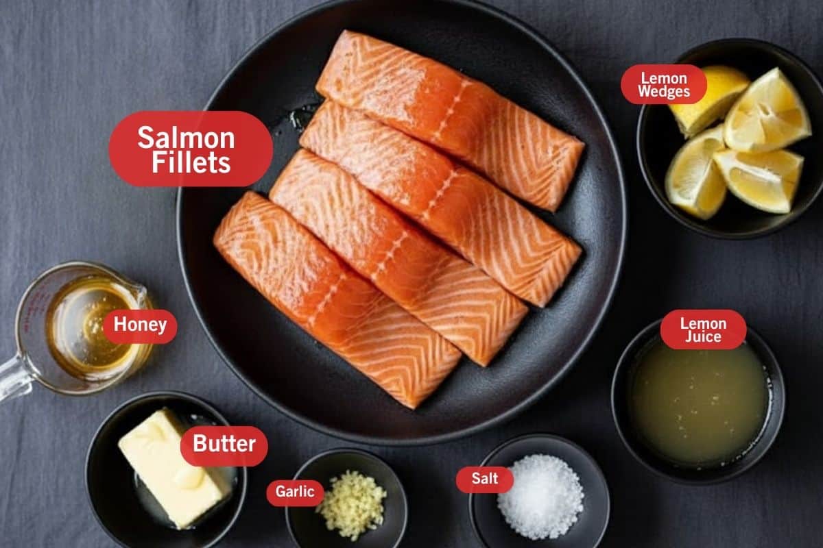 Flat lay photo of ingredient shot of salmon fillets, lemon wedges, honey, butter, garlic ,salt and lemon juice